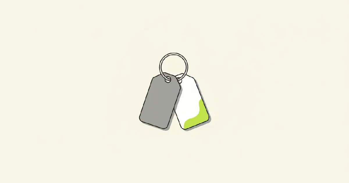 An illustration of a brass house key on a ring with an old, worn key tag still attached beside a new one.